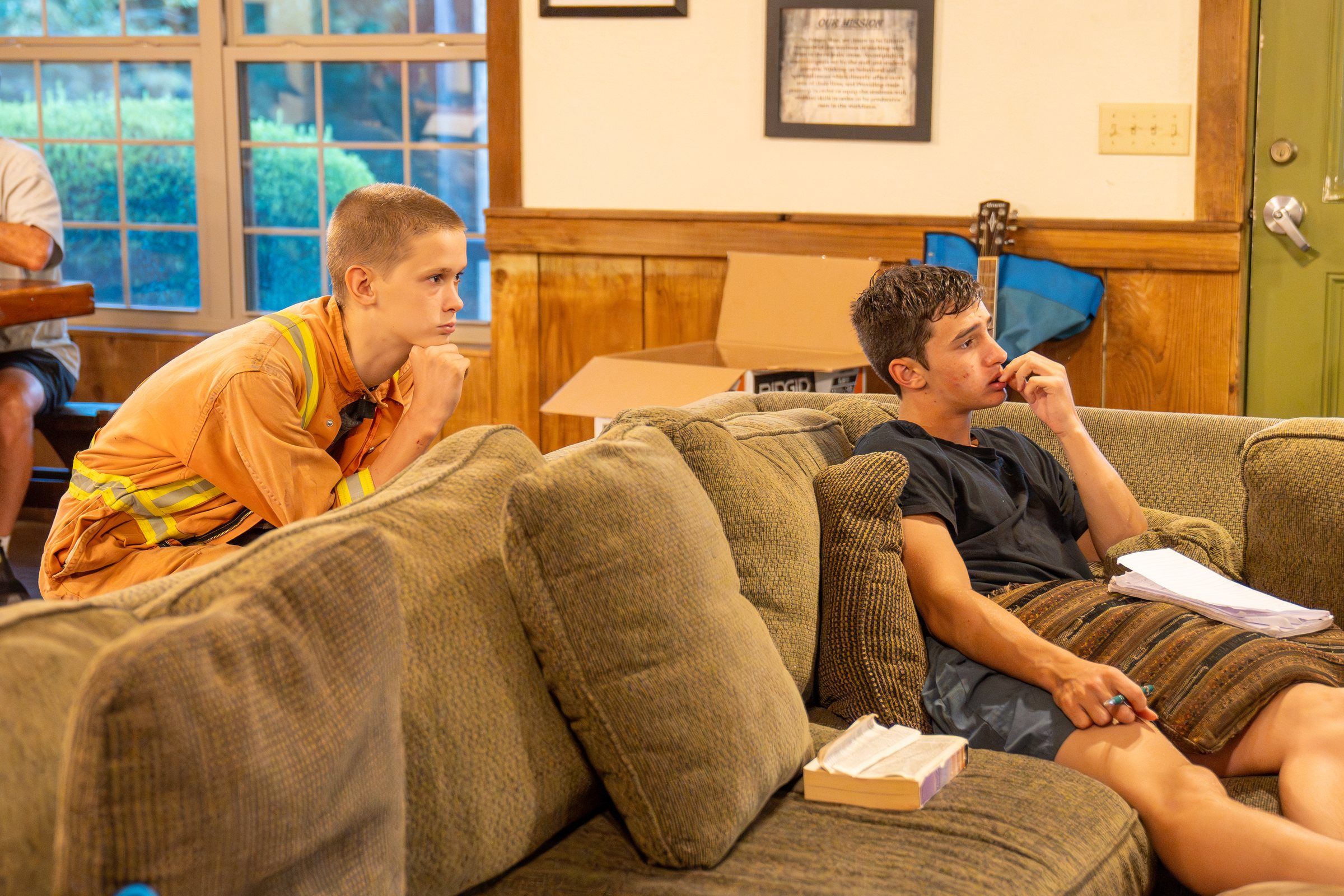 Future Men students doing coursework on the couches in the main lodge