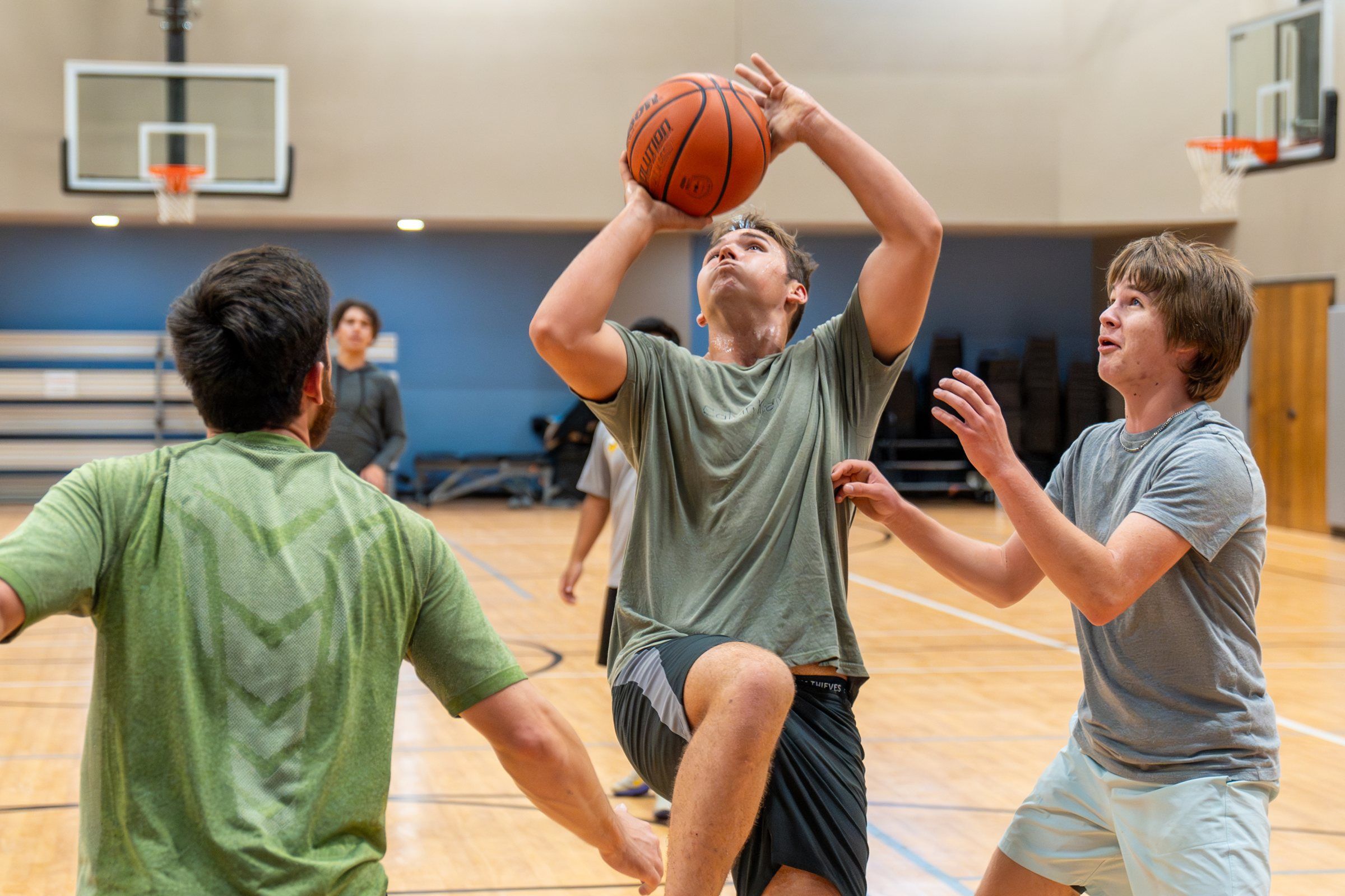 Future Men students playing basketball in the gym