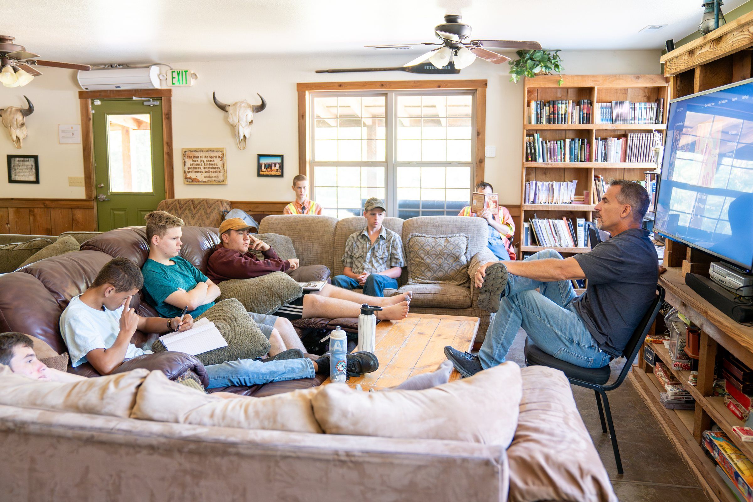 Future Men students on the couches during a group session in the lodge commons room