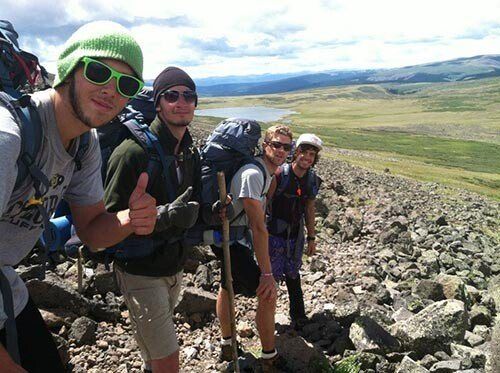 Future Men students on a rocky ridge during a hiking trip