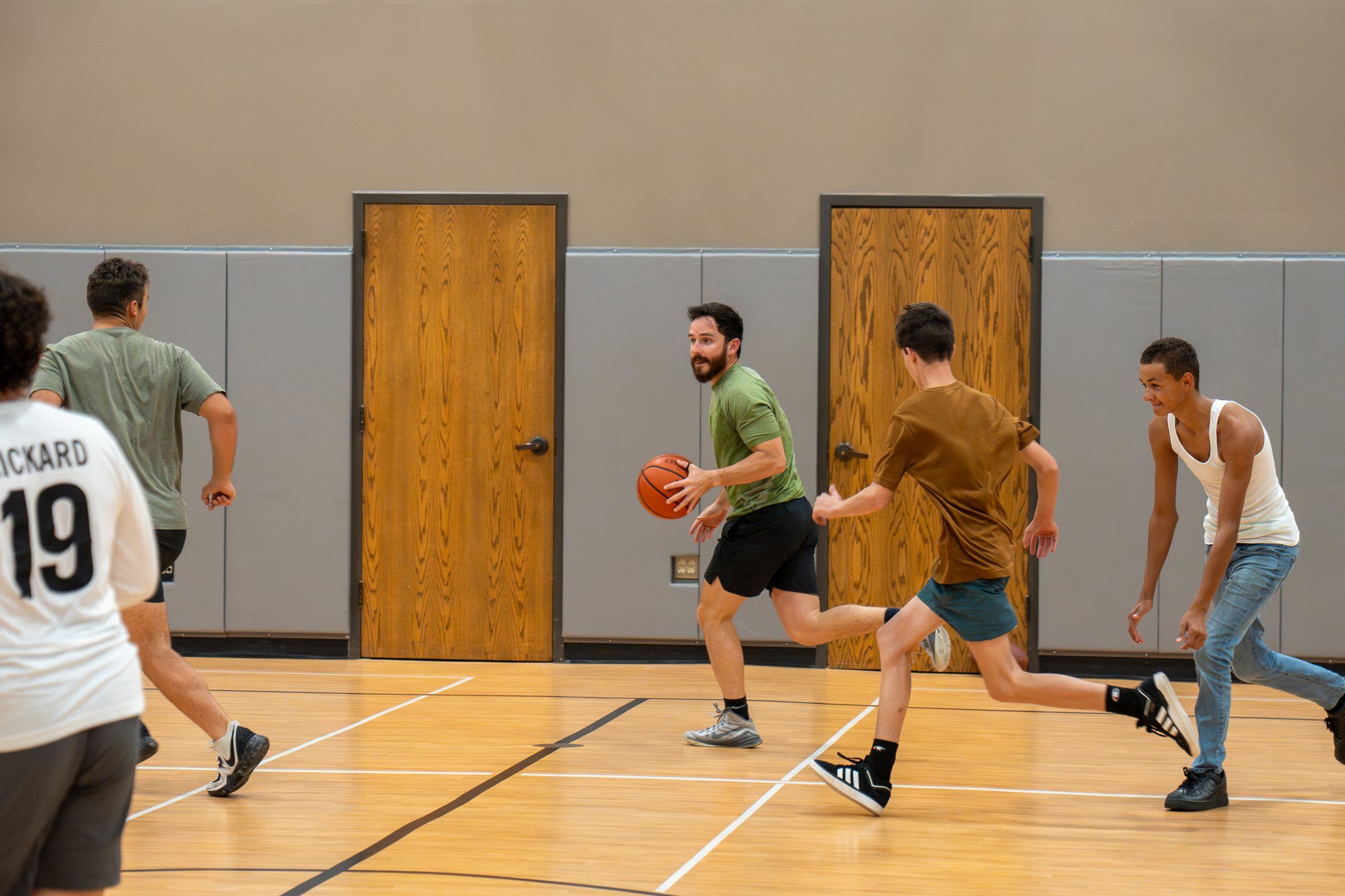 A pickup basketball game in the Future Men gym